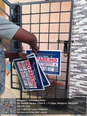 Lens & Meds No Parking Boards Tying